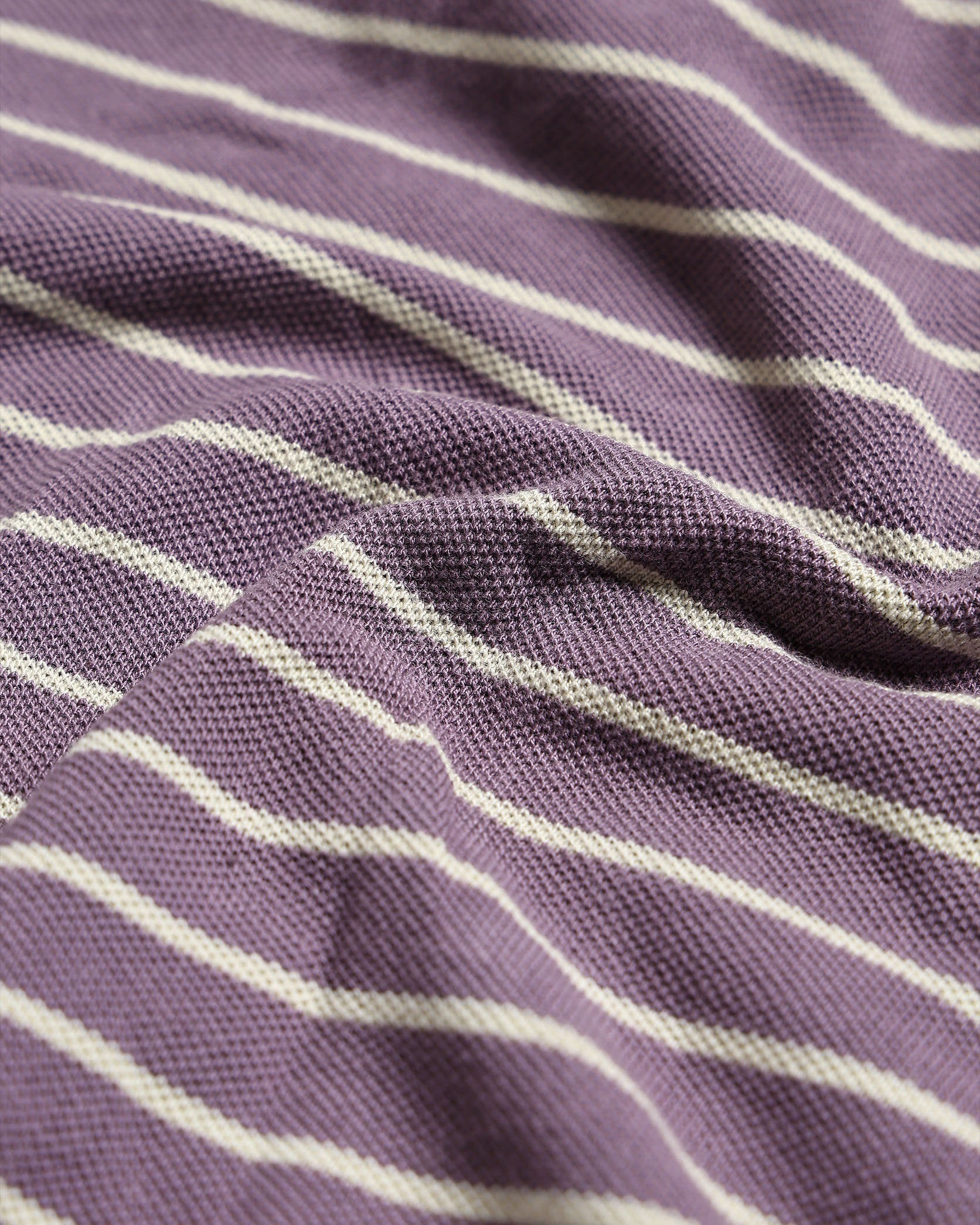 Close-up of purple fabric with white stripes