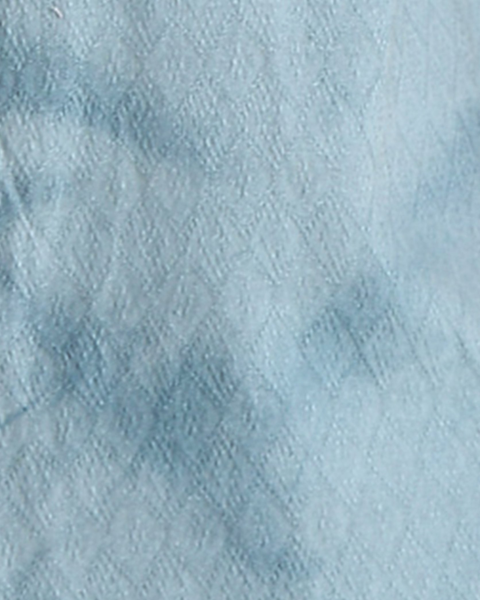 Close-up of textured light blue fabric