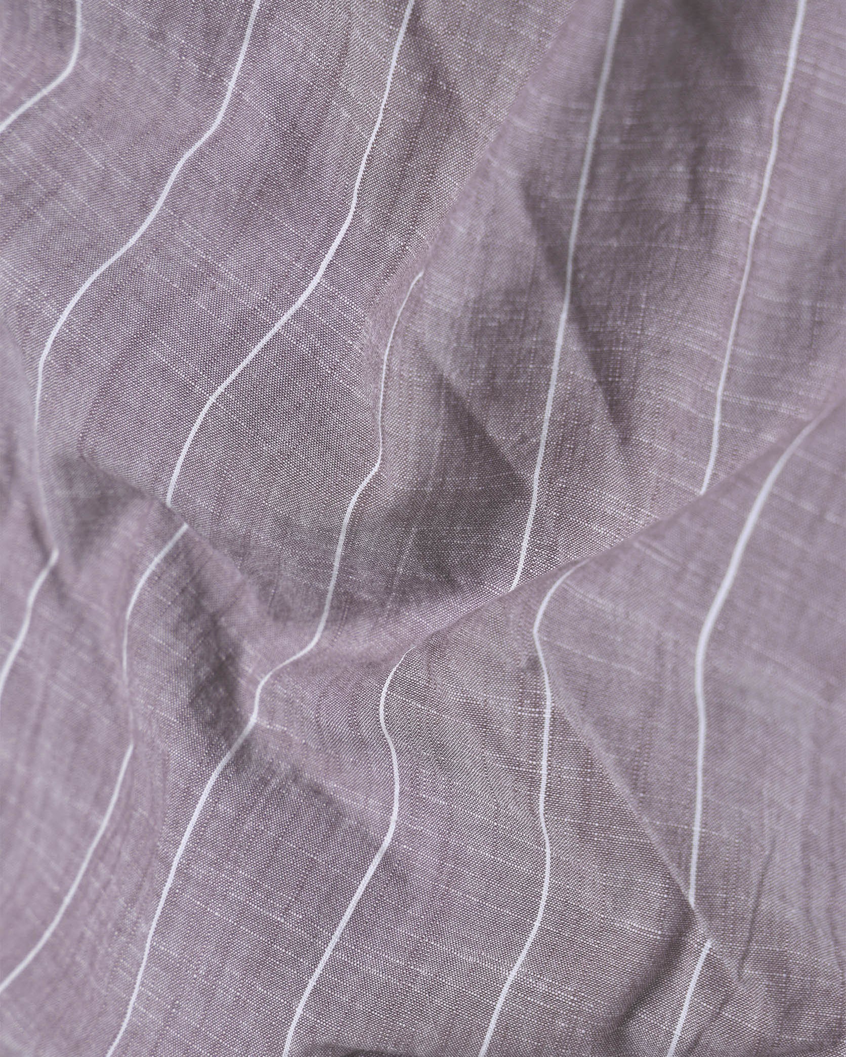 Close-up of purple fabric with white lines