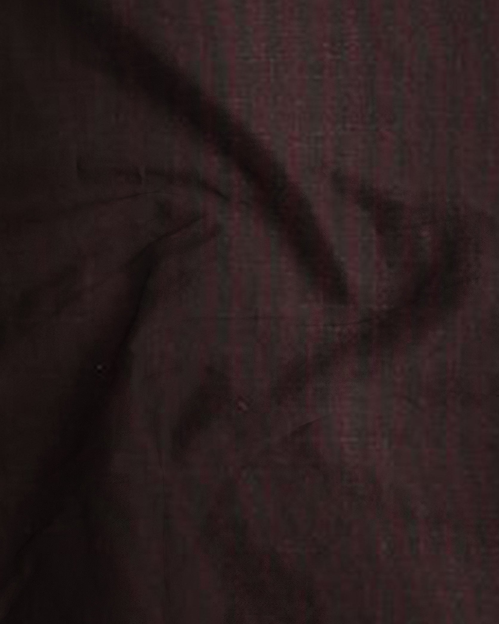 Close-up of dark brown fabric texture