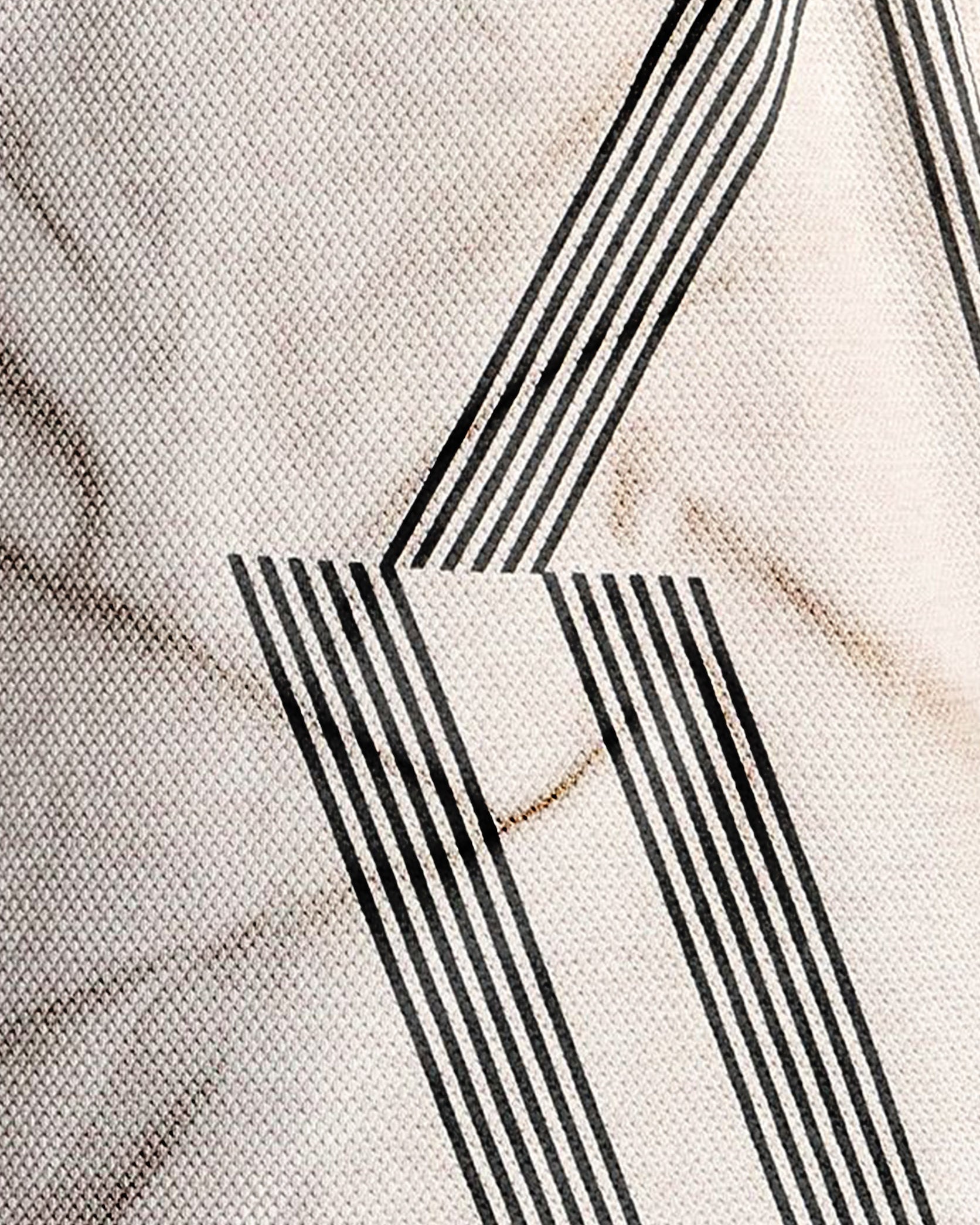 Close-up of a textured surface with black geometric patterns