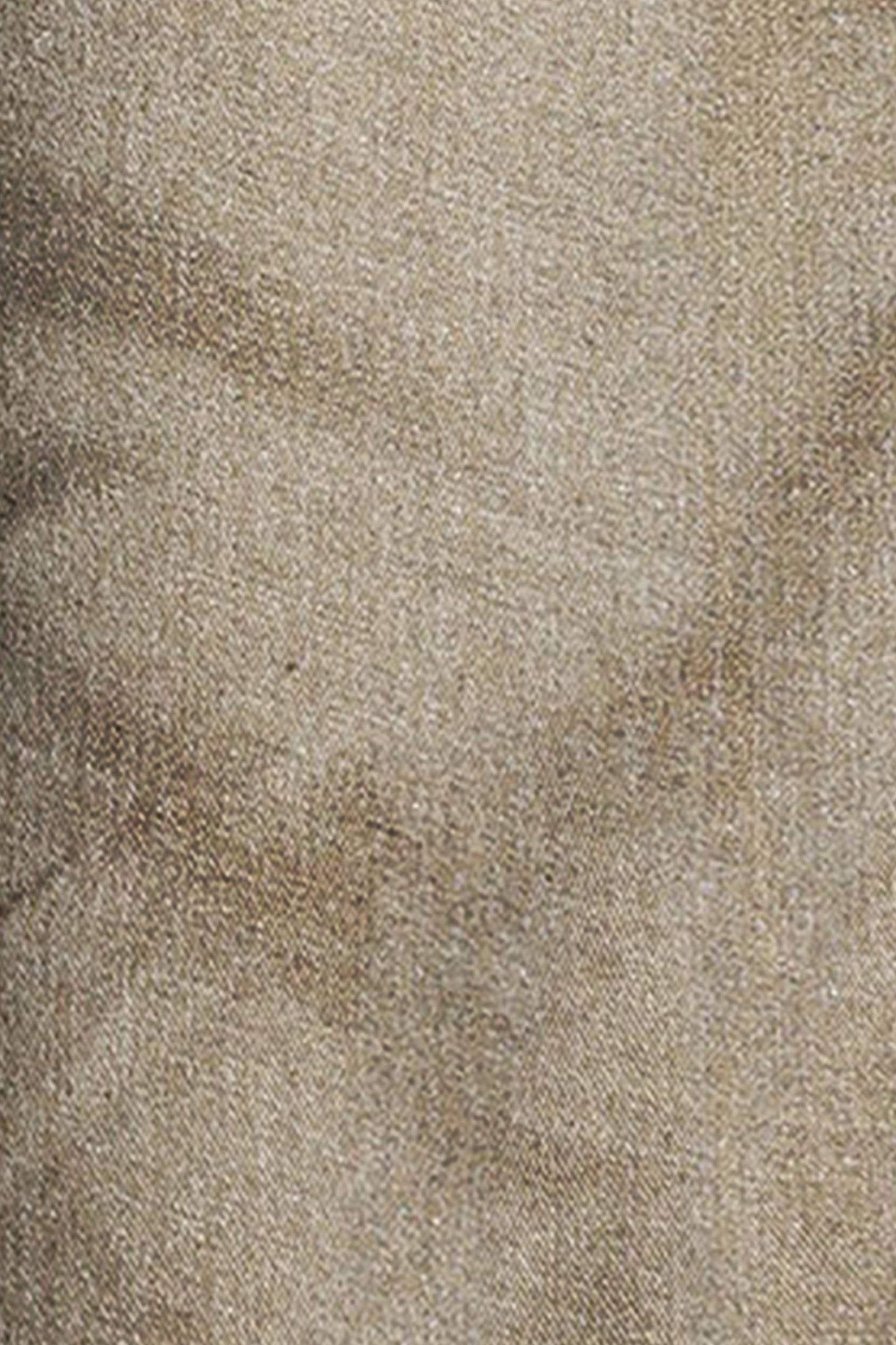 Close-up of a textured beige fabric surface