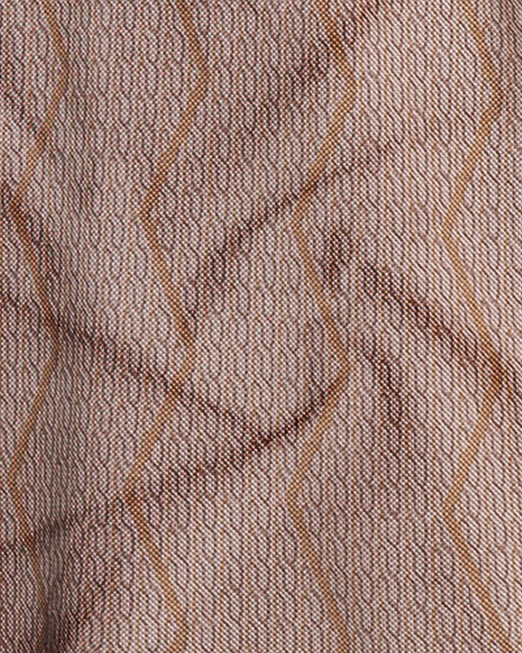 Close-up of a textured fabric with wavy lines in brown tones.