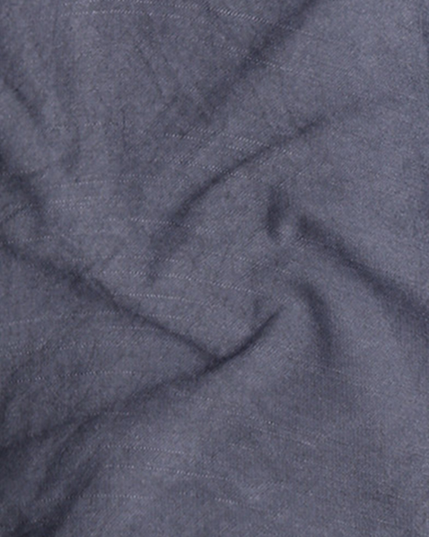 Close-up of textured blue fabric with folds
