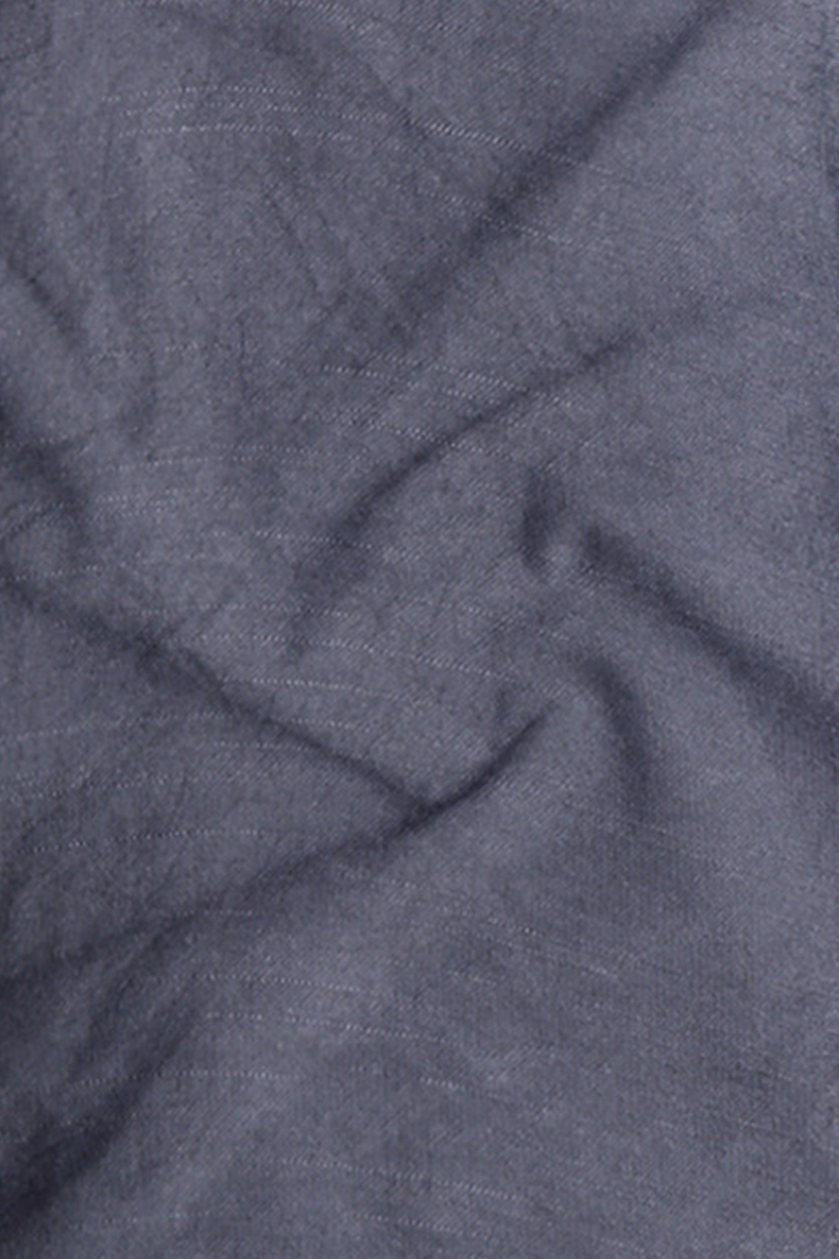 Close-up of textured blue fabric with folds