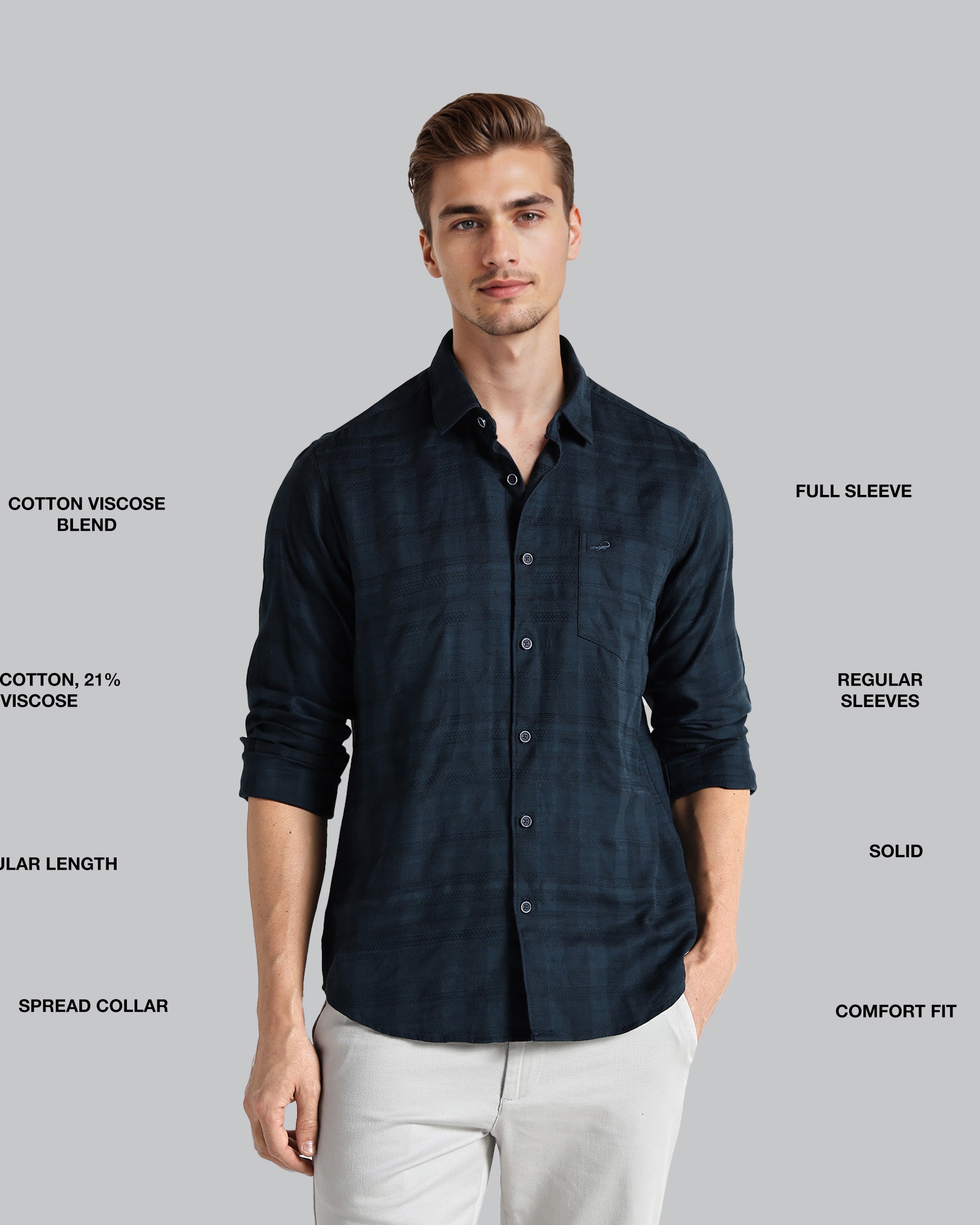 Man wearing a dark blue shirt with text detailing fabric blend, sleeve length, and other features on a gray background
