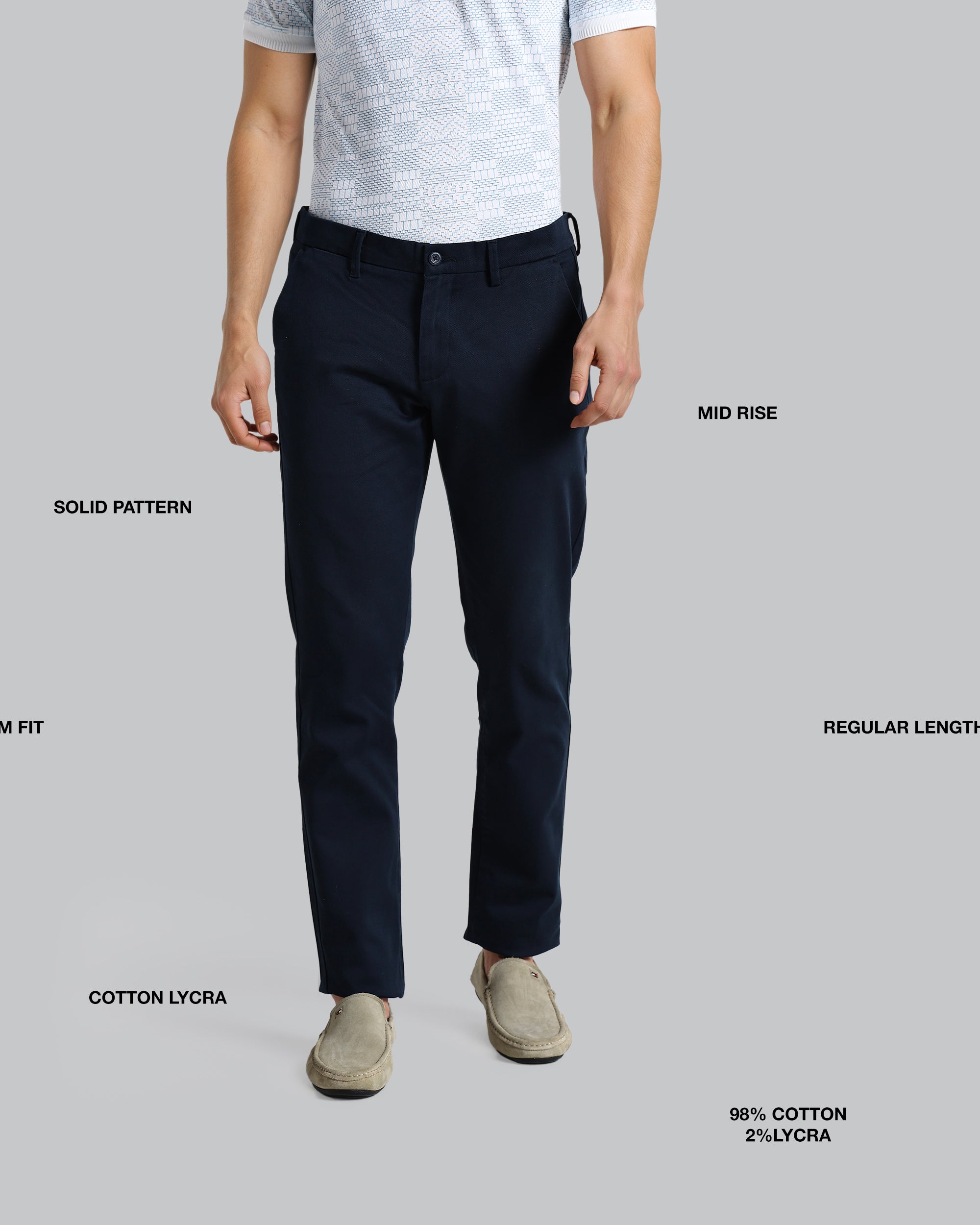 Person wearing navy pants on a gray background with text labels.