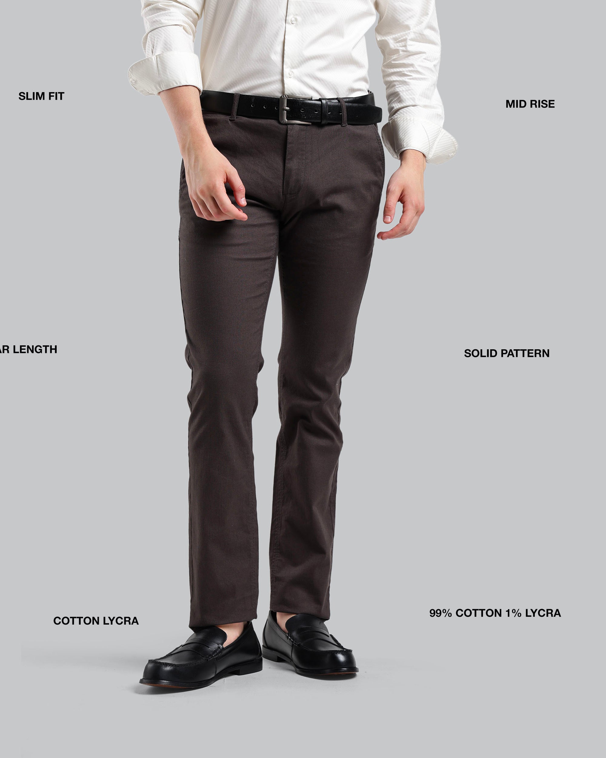 Brown pants with label details on a gray background