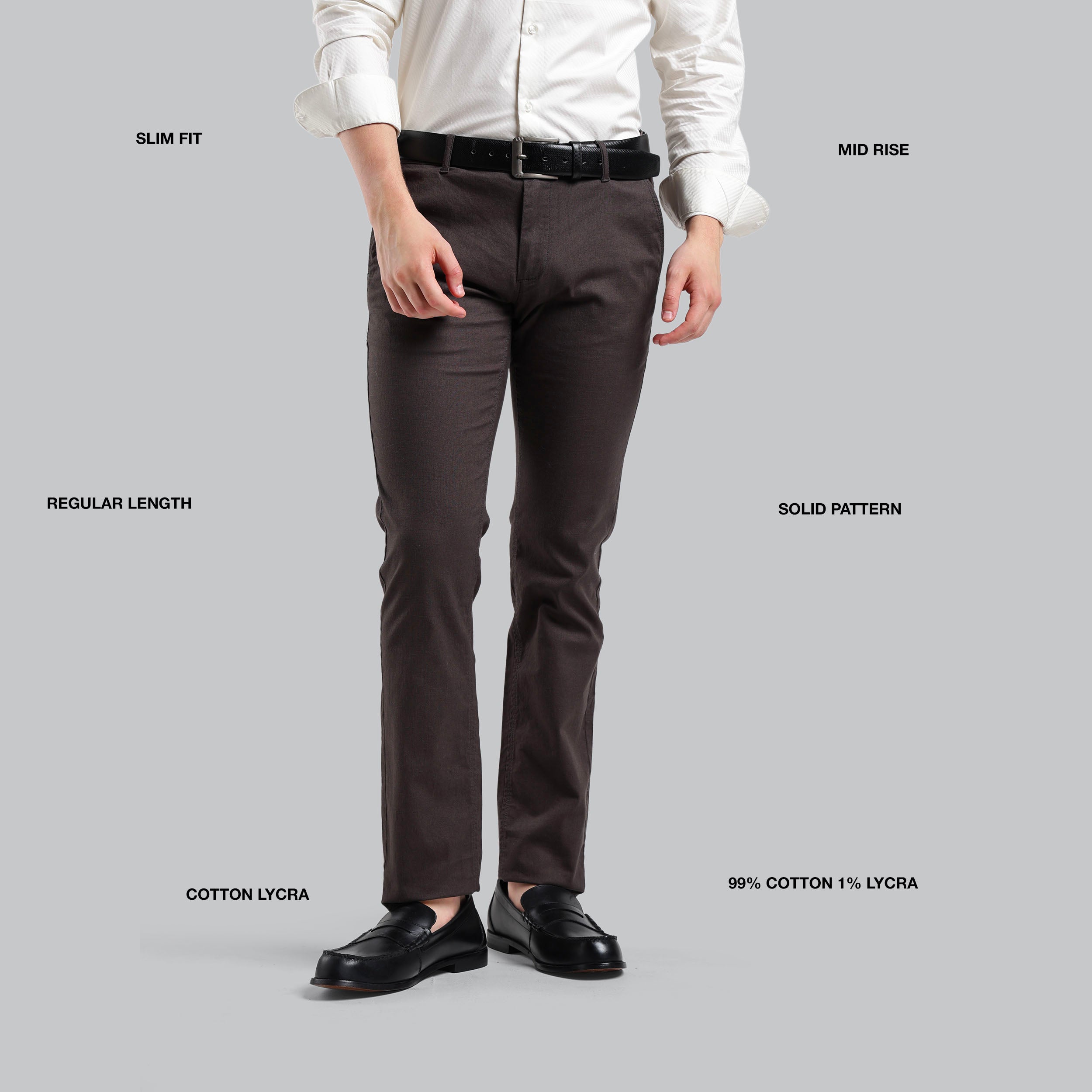 Brown pants with label details on a gray background
