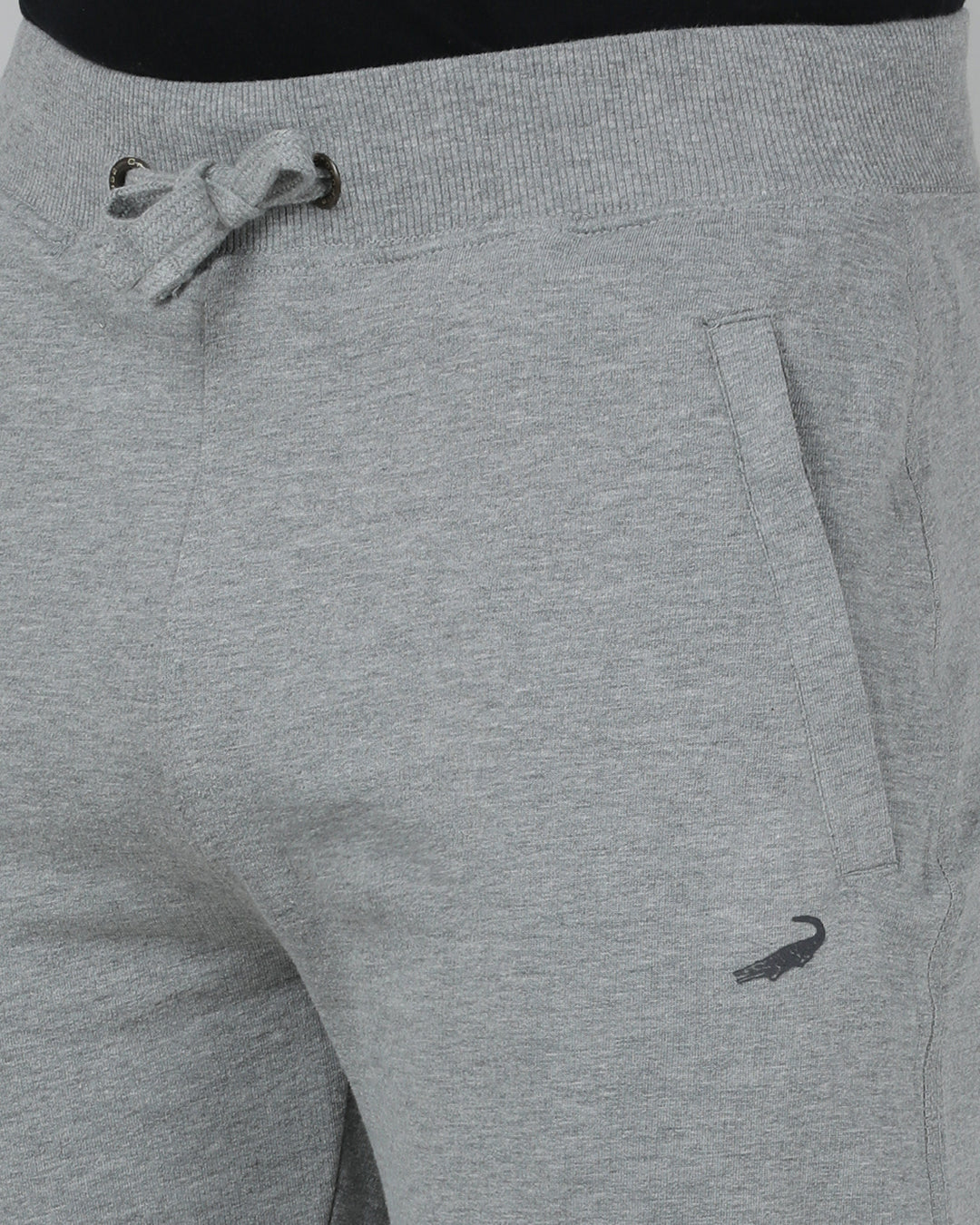 Gray sweatpants with a drawstring and small logo on a plain background