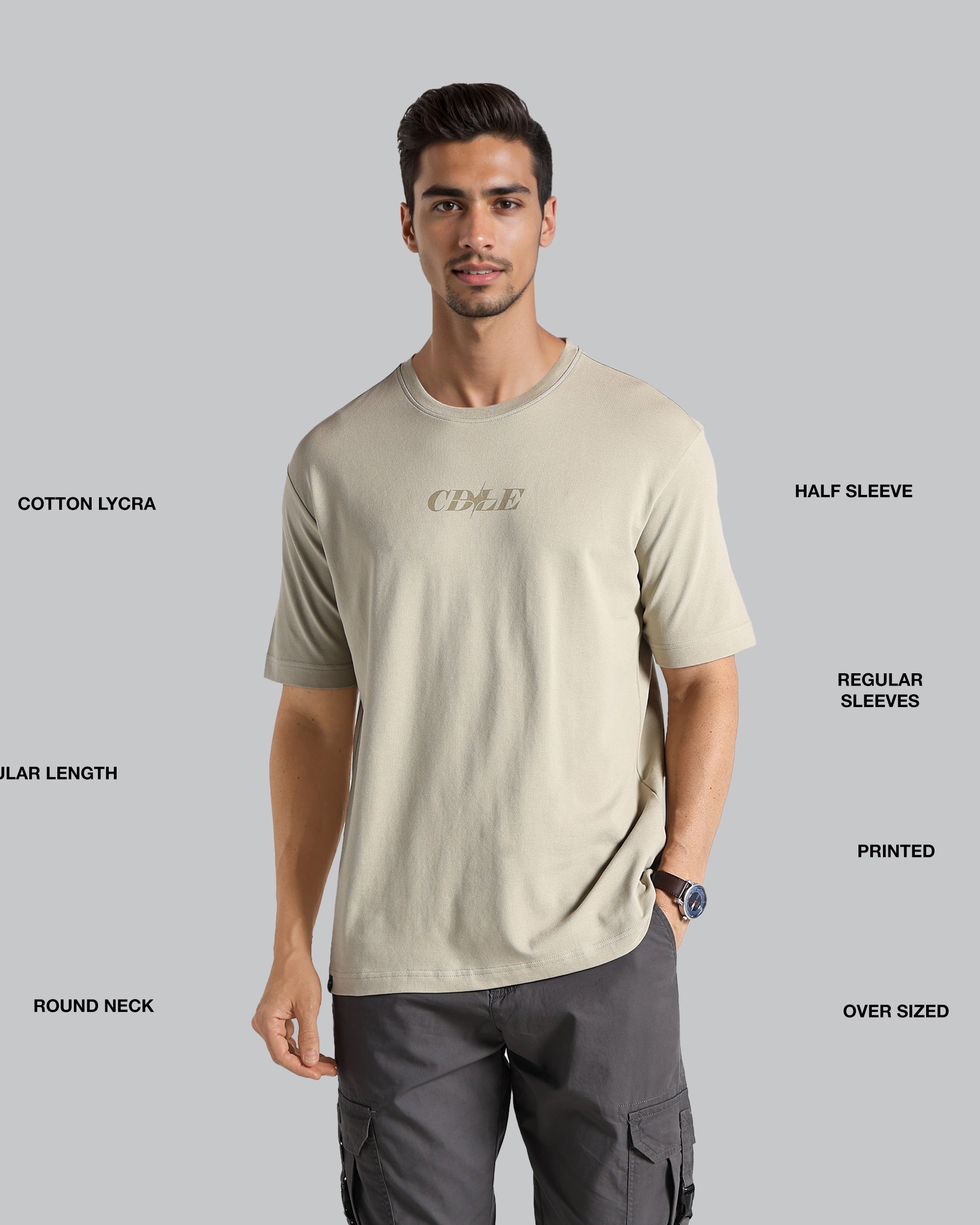 Man wearing a beige t-shirt with text on a gray background