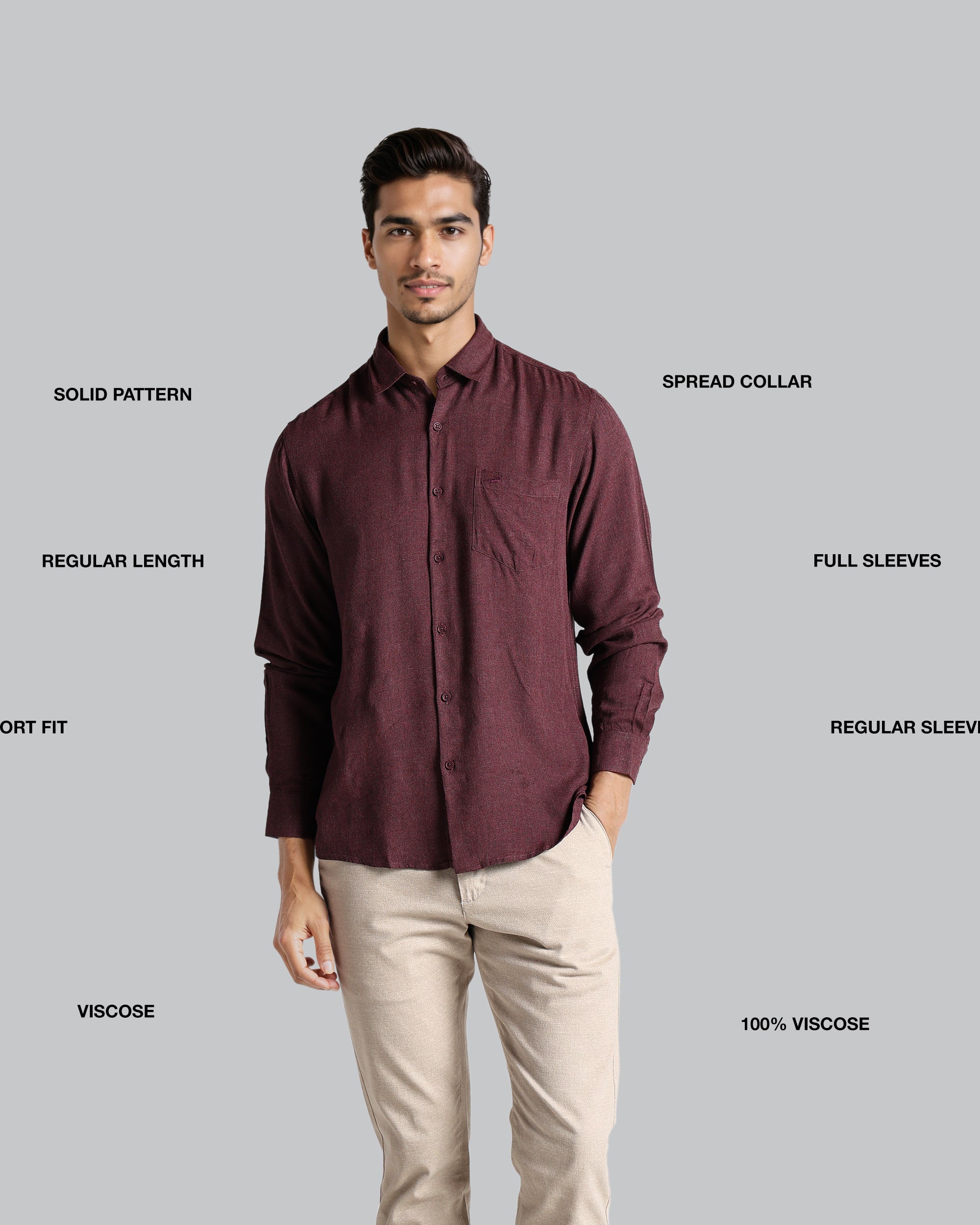 Man wearing a maroon shirt with text labels on a gray background