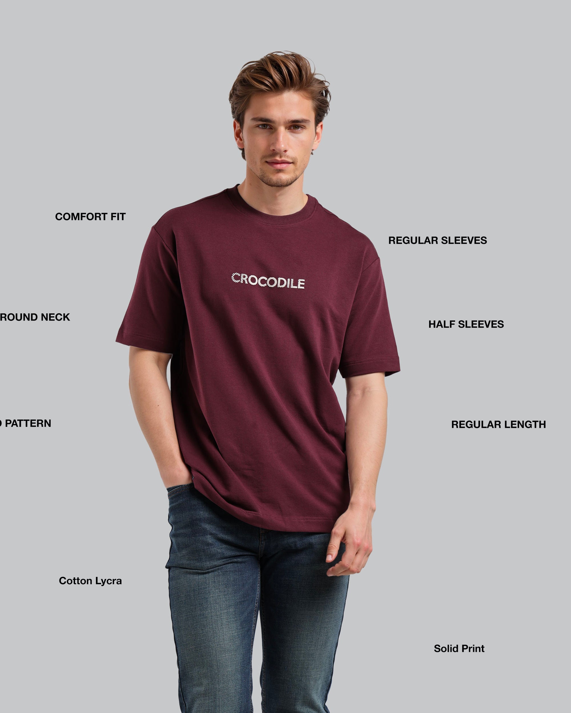 Man wearing a maroon t-shirt with 'Crocodile' branding on a gray background