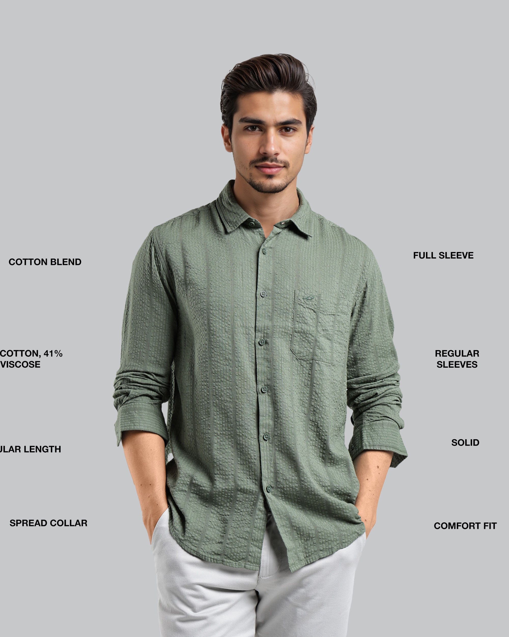 Man wearing a green shirt with text detailing fabric blend, sleeve length, and other features on a gray background
