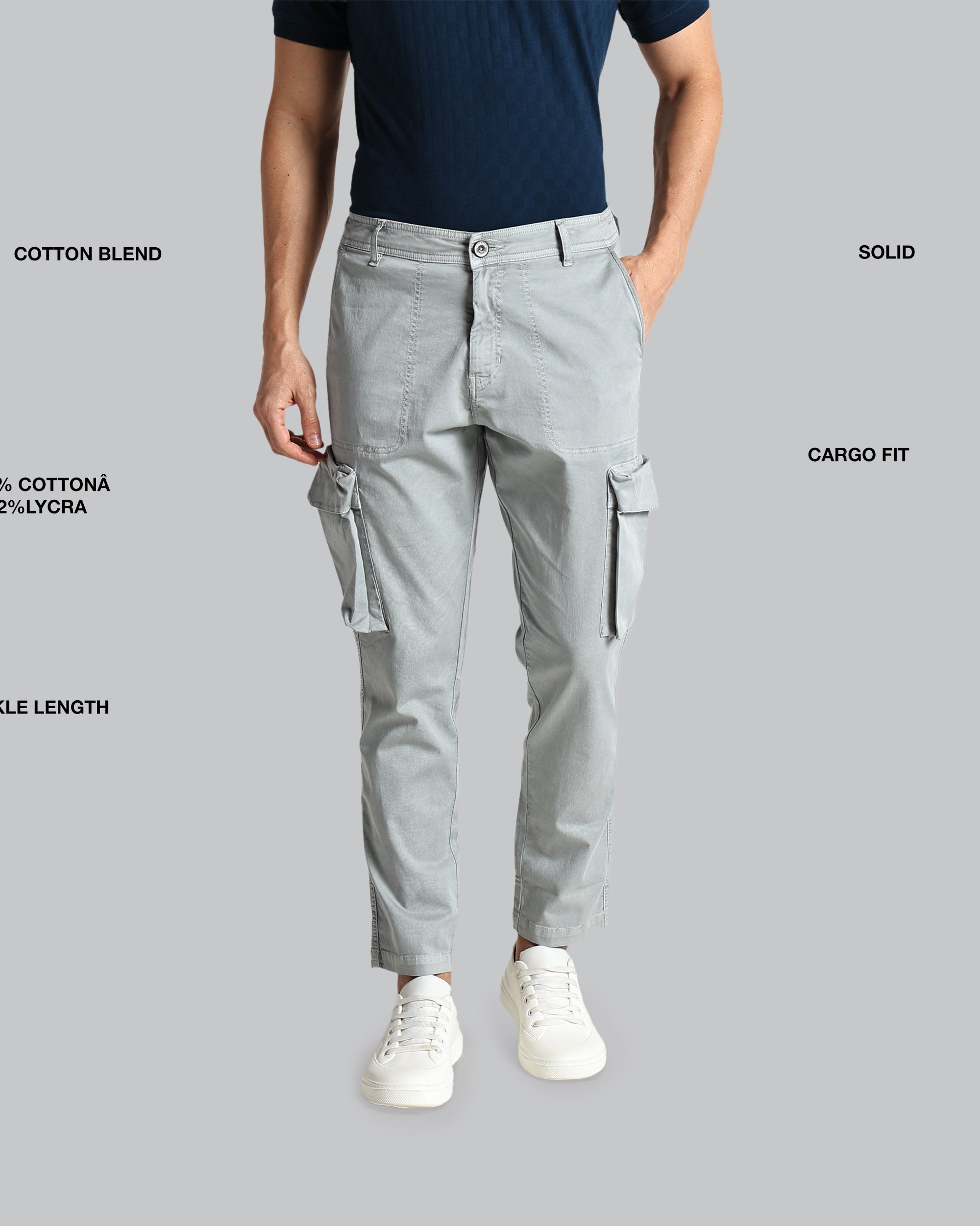Person wearing gray cargo pants with text detailing fabric blend, length, and fit on a gray background