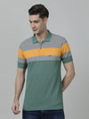 Man wearing a cream dark ivy cream striped polo t shirt with casual styling on a gray background