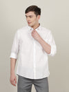 Man wearing a white solid casual full sleeve 100% cotton shirt white on a light gray background