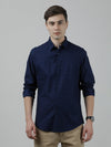 Man wearing a navy navy full sleeve 100% cotton printed shirt with casual styling on a gray background
