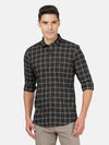 Man wearing a black black checked full sleeve casual shirt with casual styling on a gray background