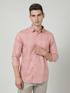 Man wearing a peach checked full sleeve 100% cotton shirt on a light gray background