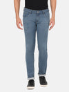 Man wearing a blue solid light blue mid rise slim fit jean on a light gray background