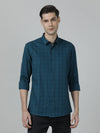 Man wearing a green checked full sleeve 100% cotton green shirt on a light gray background
