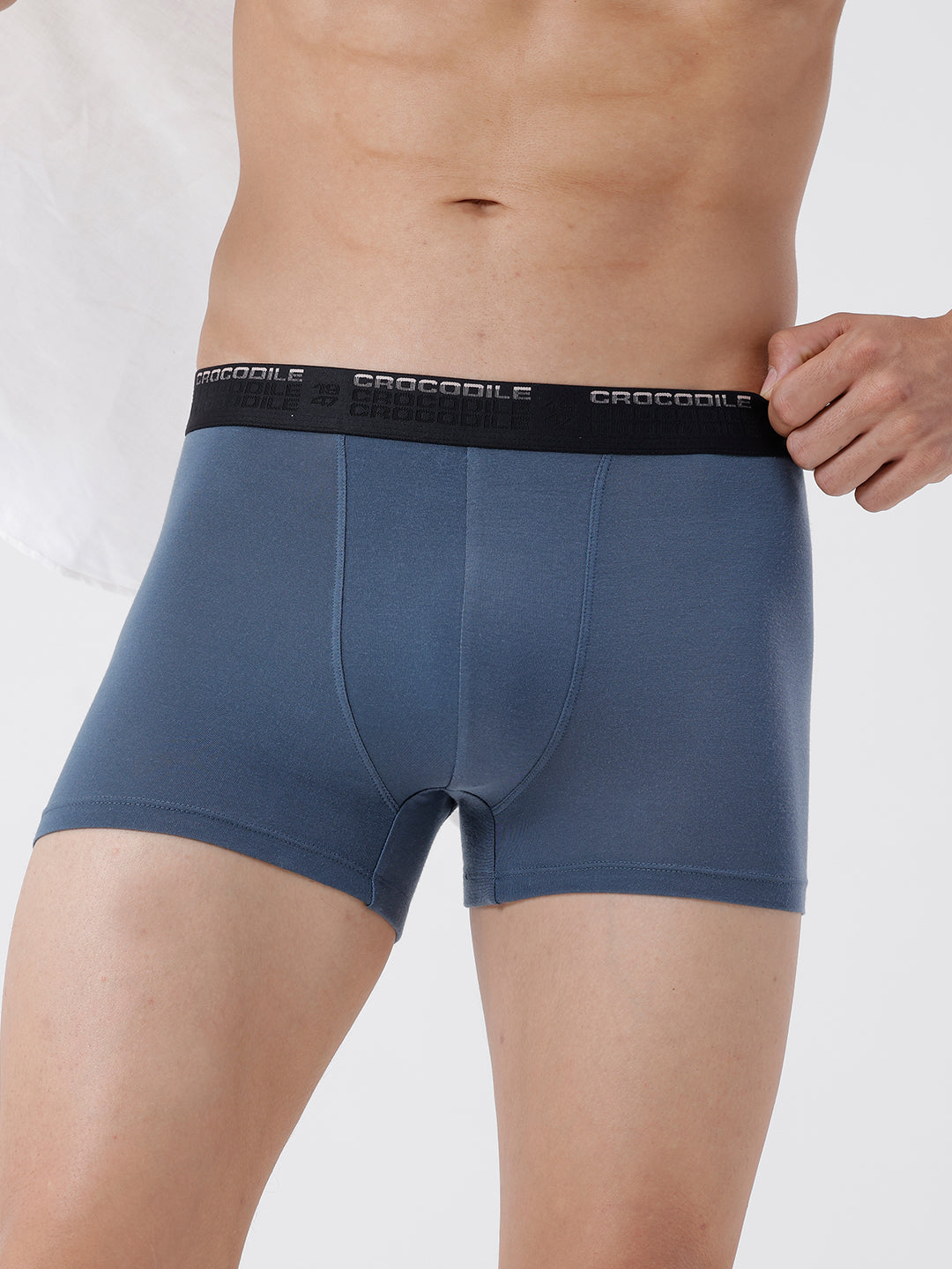 Blue boxer briefs with a black waistband on a white background