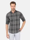Man wearing a grey dark grey checked full sleeve 100% cotton shirt with casual styling on a gray background