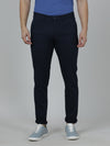 Man wearing a navy solid navy trim fit trouser with casual styling on a gray background