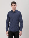 Man wearing a navy checked casual full sleeve 100% cotton navy shirt with casual styling on a gray background