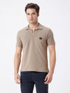 Man wearing a wood solid comfort fit polo t shirt with casual styling on a gray background
