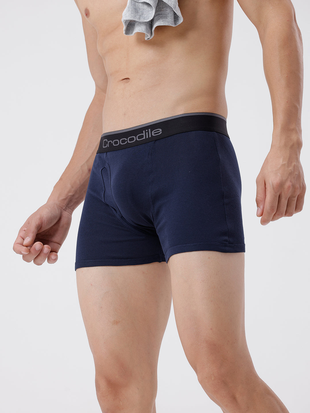Navy blue boxer briefs with a brand logo on a plain background