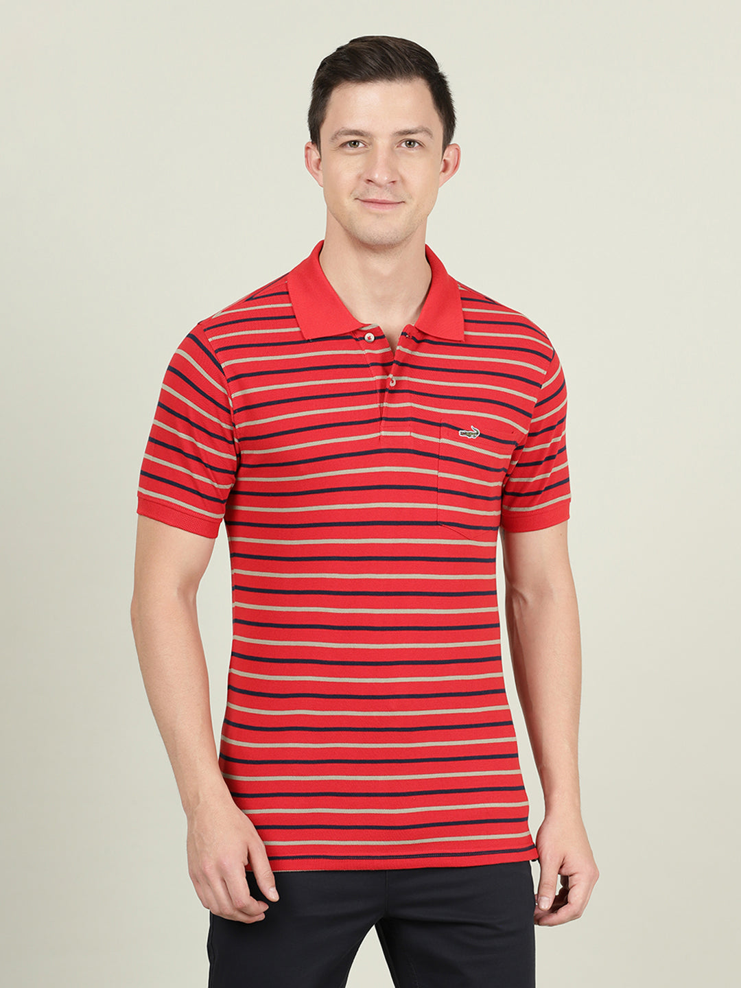 Man wearing a red red striped casual polo t shirt on a light gray background