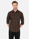 Man wearing a brown casual checked brown full sleeve shirt with casual styling on a gray background