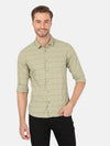 Man wearing a green green casual checked full sleeve shirt with casual styling on a gray background