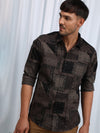 Man wearing a brown brown printed full sleeve casual 100% cotton shirt with casual styling on a gray background