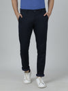 Man wearing a navy navy casual printed trouser with casual styling on a gray background