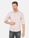 Man wearing a brown light brown checked full sleeve shirt with casual styling on a gray background