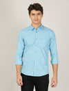 Man wearing a blue blue printed full sleeve 100% cotton casual shirt with casual styling on a gray background