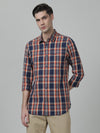 Man wearing a navy checked full sleeve 100% cotton navy shirt with casual styling on a gray background