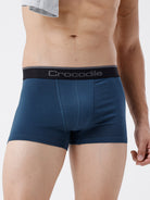 Blue men's underwear with black waistband featuring 'Crocodile' brand on a white background