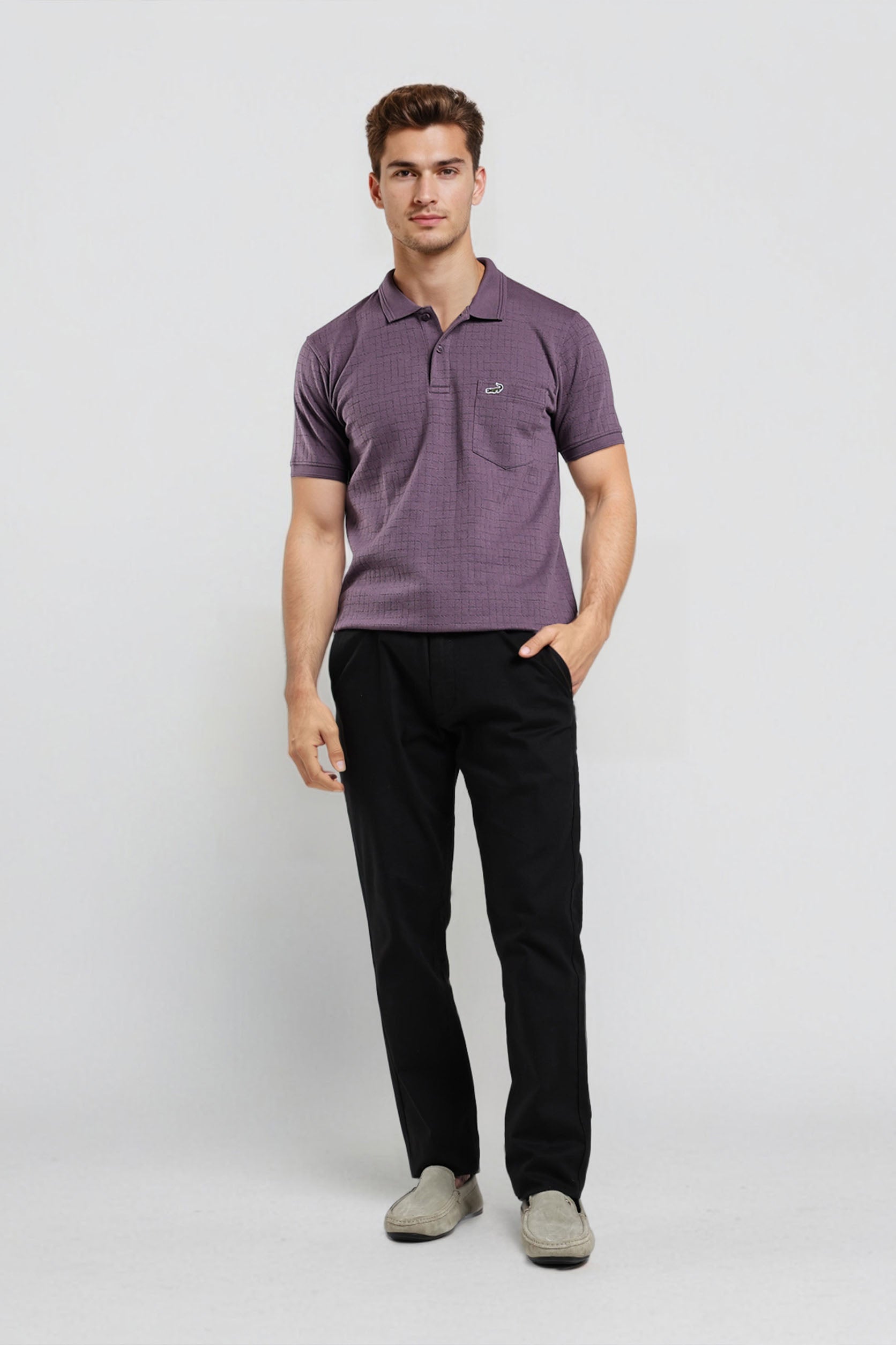 Man wearing a purple striped polo shirt and black pants on a white background