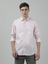 Man wearing a pink pink checked full sleeve 100% cotton casual shirt on a light gray background
