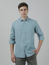 Man wearing a blue blue solid full sleeve 100% cotton casual shirt on a light gray background