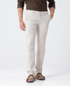 Man wearing a beige trouser light beige slim fit solid with casual styling on a gray background