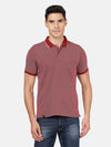 Man wearing a red casual printed polo t shirt red on a light gray background
