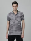 Man wearing a grey grey casual printed polo t shirt on a light gray background