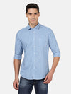 Man wearing a blue dark blue checked full sleeve cotton shirt on a light gray background