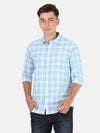 Man wearing a blue light blue checked full sleeve shirt with casual styling on a gray background