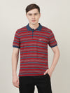 Man wearing a maroon casual striped polo t shirt with casual styling on a gray background